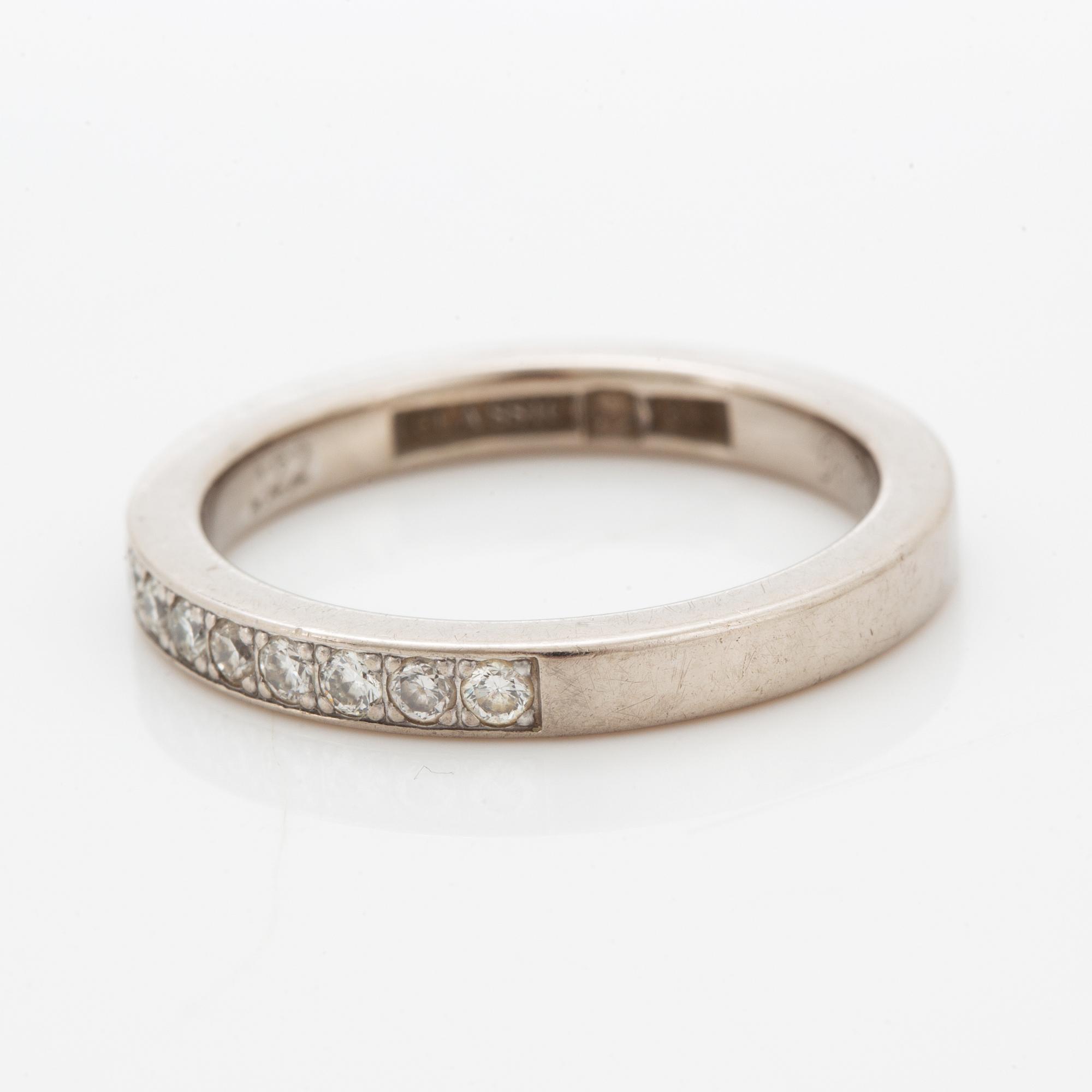 Brilliant-cut diamond half eternity ring.