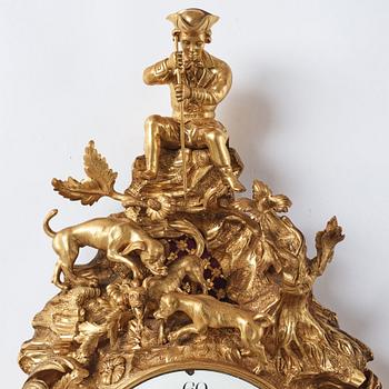 A Louis XV mid 18th century gilt bronze wall clock, "Chasse", in the style of J J de Saint Germain,