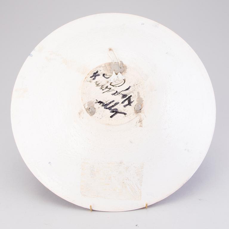 A ceramic dish signed.