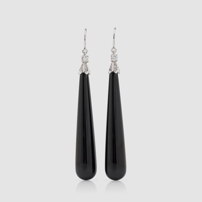 A pair of onyx and brilliant-cut diamond earrings. Totral carat weight circa 0.30 ct.