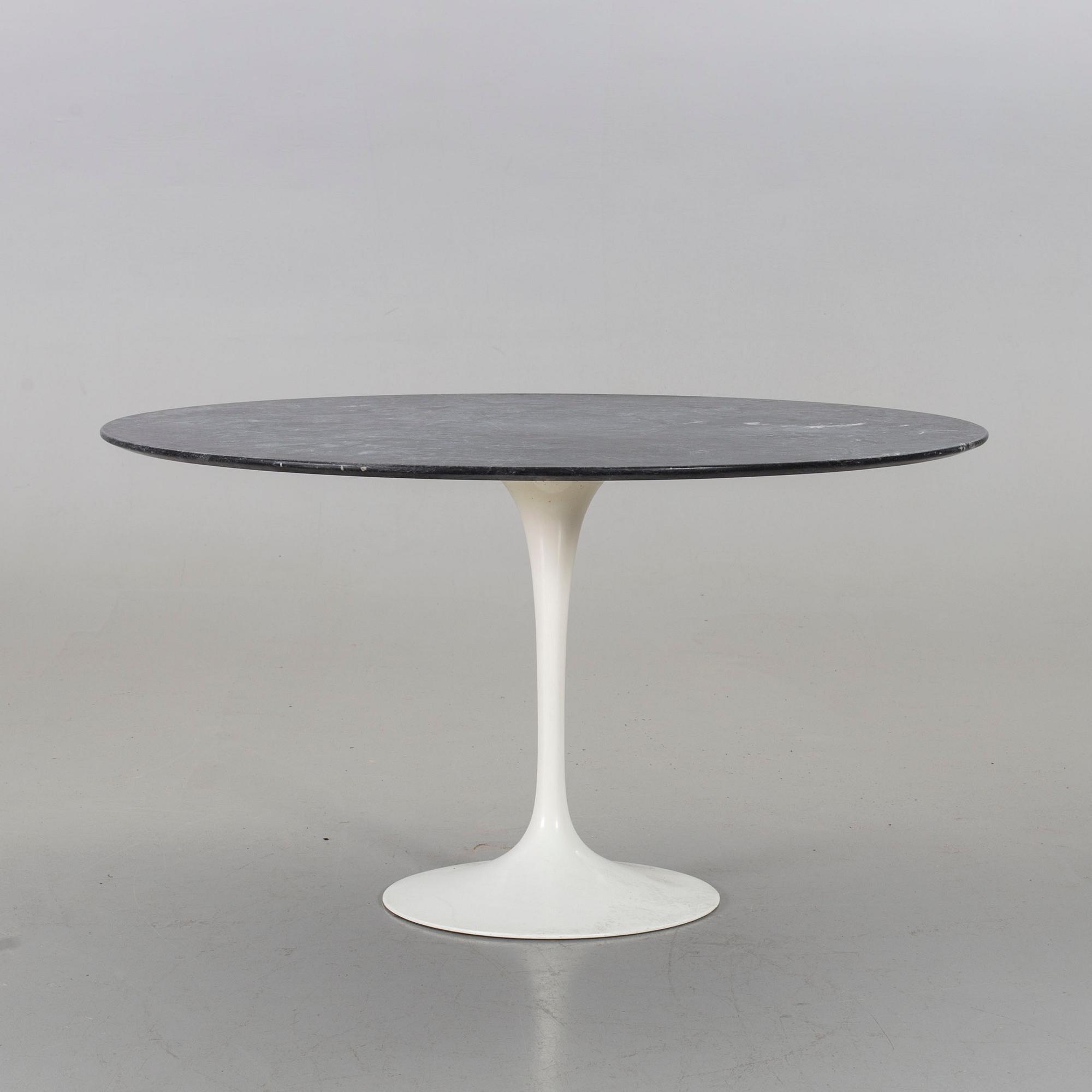 AN EERO SAARINEN "TULIP" TABLE BY KNOLL INTERNATIONAL.