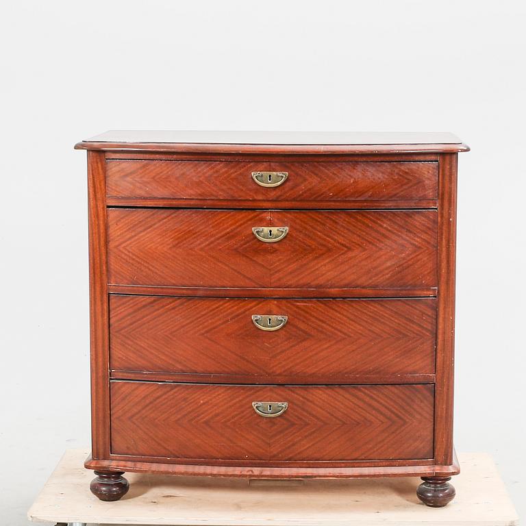 An early 1900s mahogany dresser.