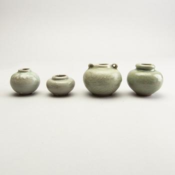 A group of four celadon glazed miniture pots, South East Asia, 16th/17th Century.