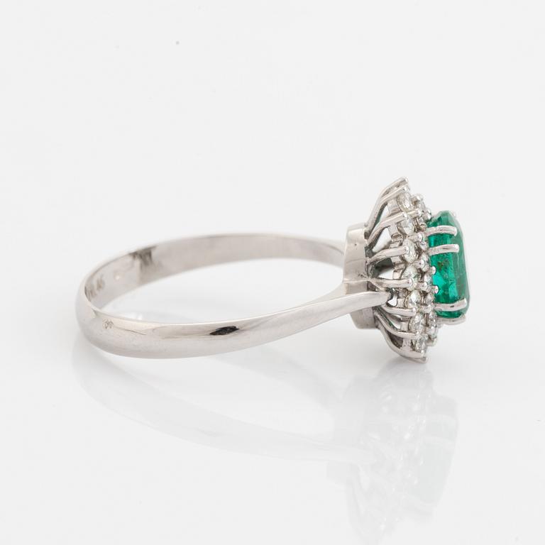 Emerald and brilliant cut diamond  cluster ring.