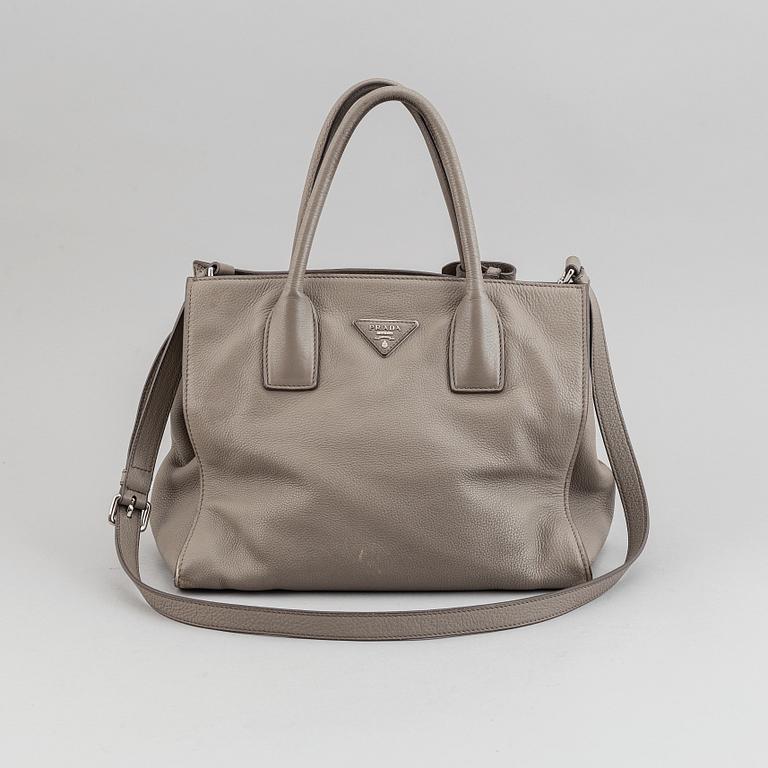Prada, a leather handbag.