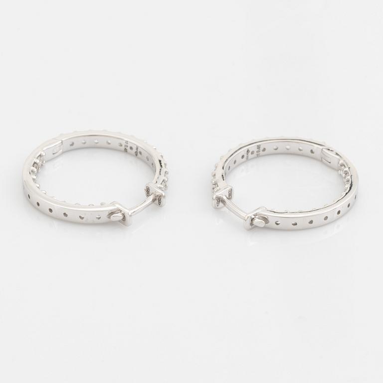 Brilliant cut diamond hoop earrings.