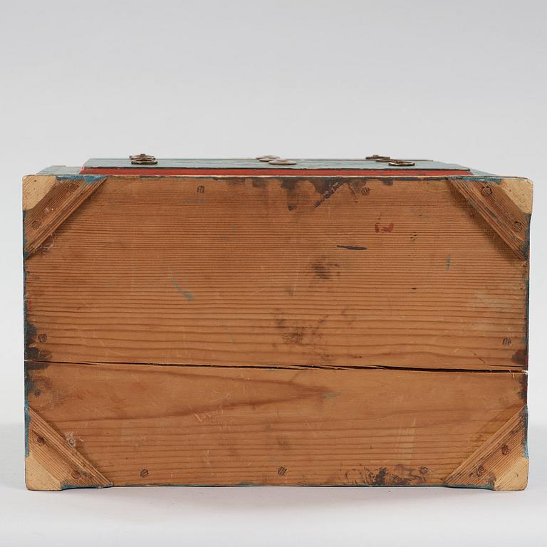 a miniature chest of drawers from the 19th century.