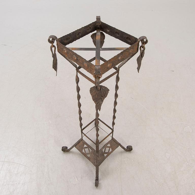 A metal pedestal and urn early 1900s.
