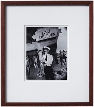 Weegee, "Park Department attendant with lost child, Coney Island, Brooklyn, New York, June 9, 1941".