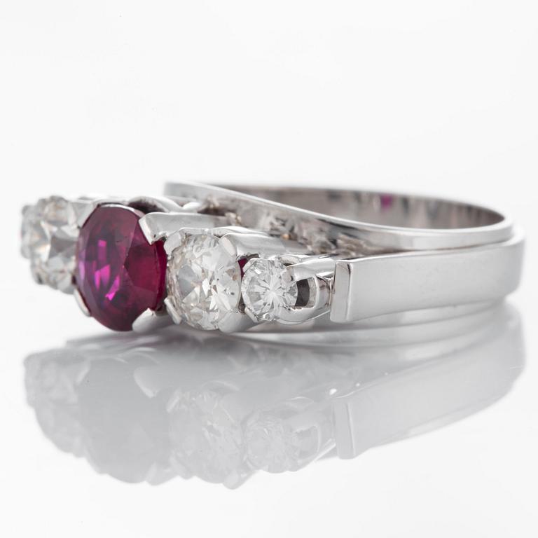 An Atelier Ajour ring set with a ruby ca 0.95 ct and old-cut diamonds with a total weight of ca 1.20 cts.