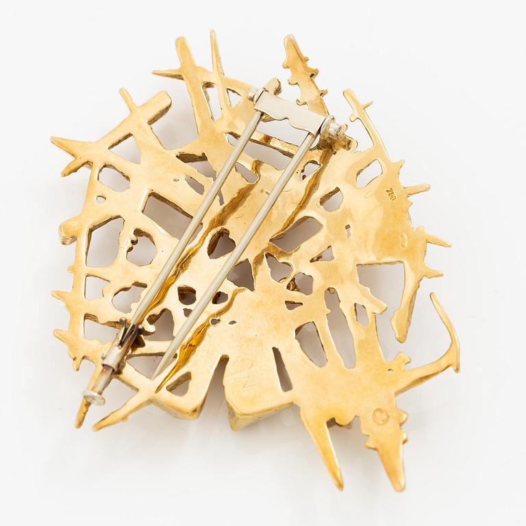Brosch 18K guld med fasettslipade rubiner.