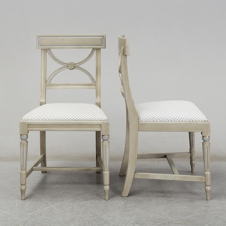 A dining table and six chairs, Gustavian style, second half of the 20th century. One leaf included.