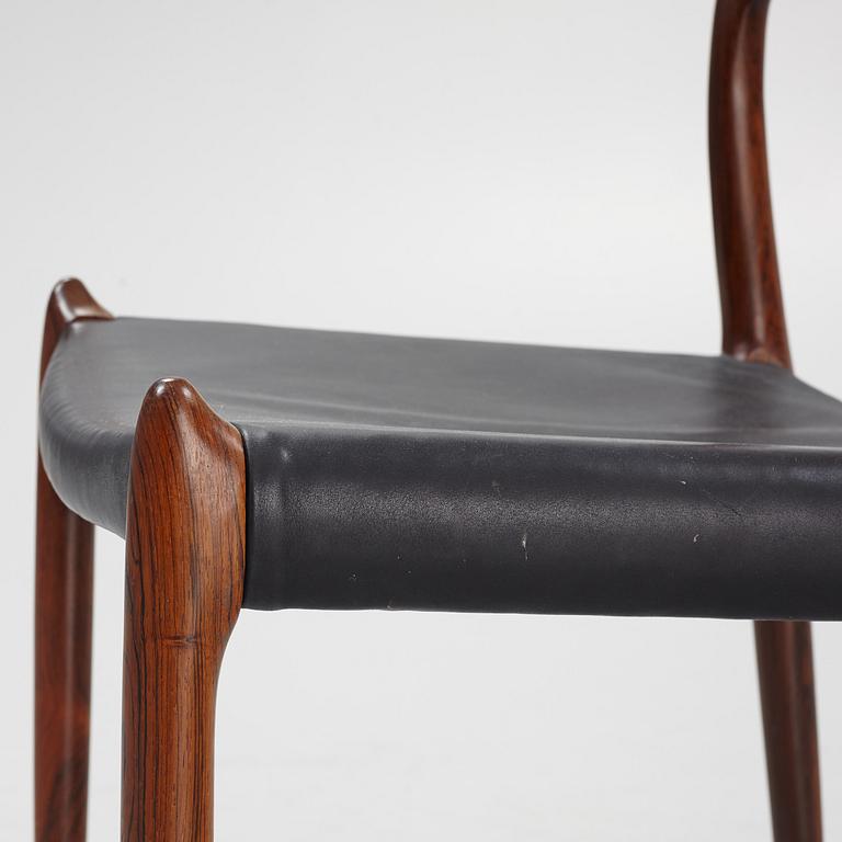 Niles Otto Møller, a rosewood veneered table with four chairs, JL Møller, Denmark, 1950's/60's.