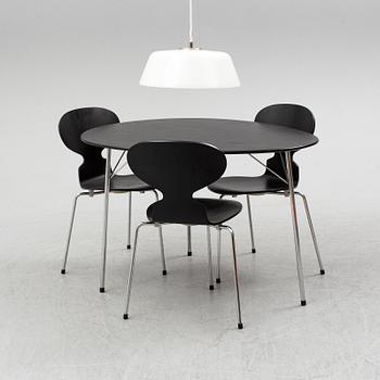 An Arne Jacobsen "Centenary Package" comprising three "Ant Chairs" and an eggshaped table, Fritz Hansen, Denmark.