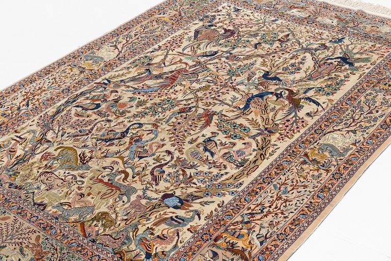 A carpet, semi-antique Esfahan, part silk, signed Eshan doust, ca226,5 x 126 cm.