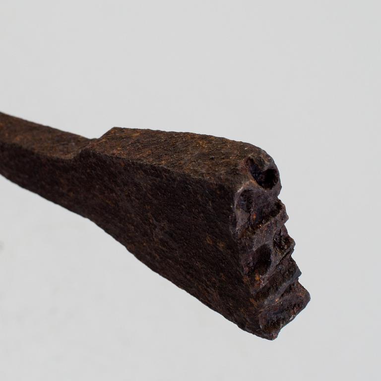 A 18th century branding iron.