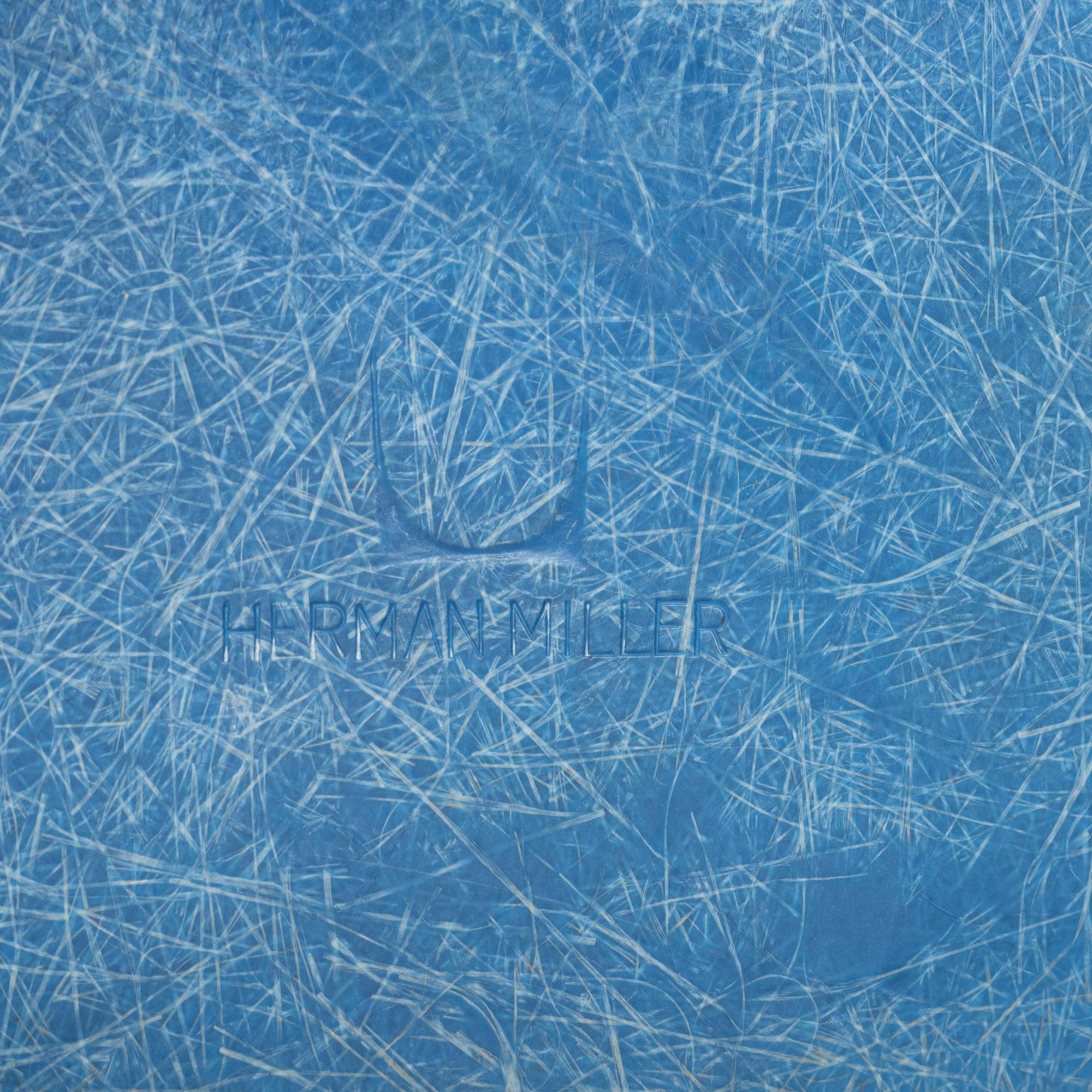 A set of four Charles and Ray Eames 'Plastic Chair DSW' with later stands, designed 1950.