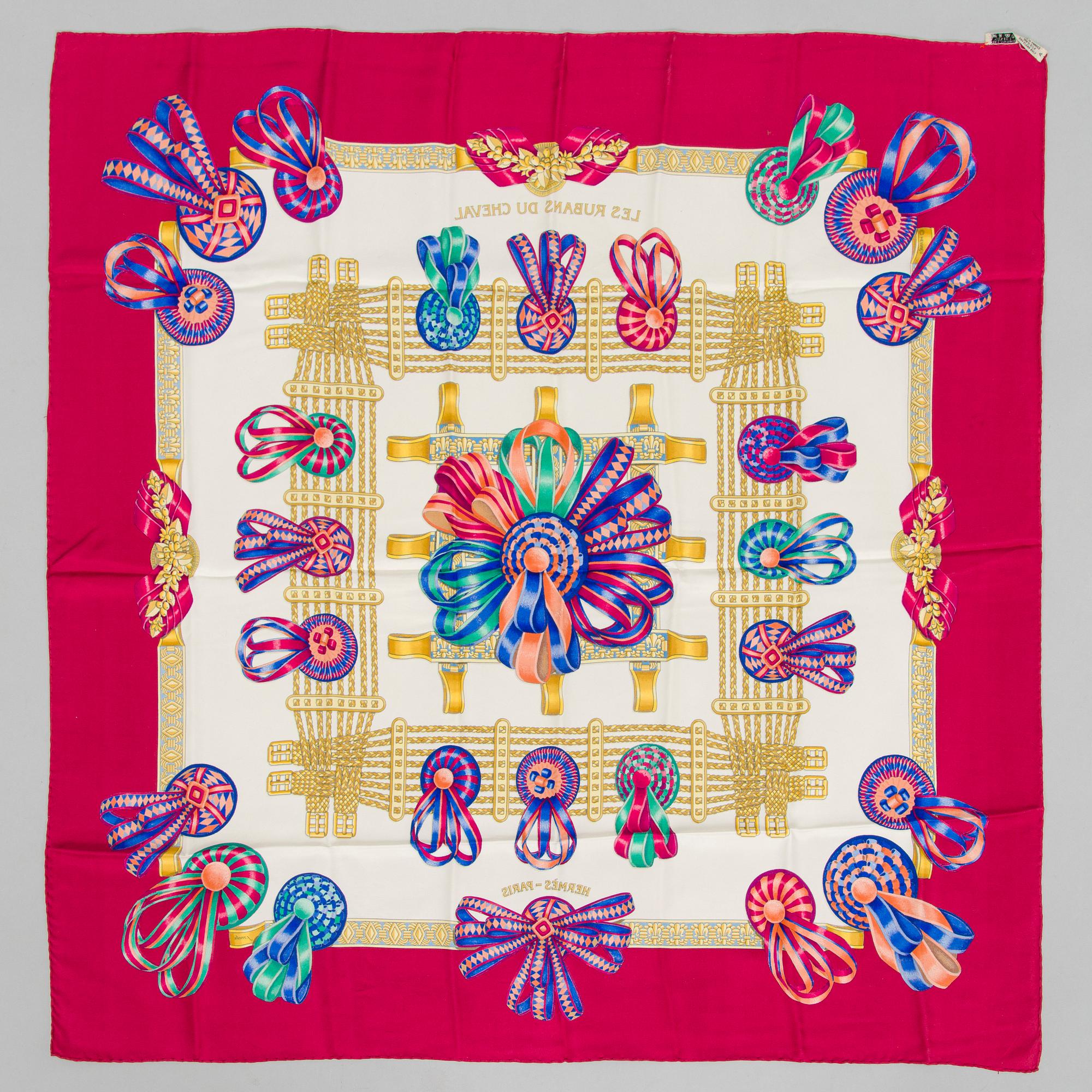 Hermès, a 'Les Rubans du Cheval' silk scarf.