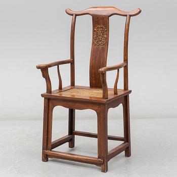 A Chinese wooden armchair, 20th century.