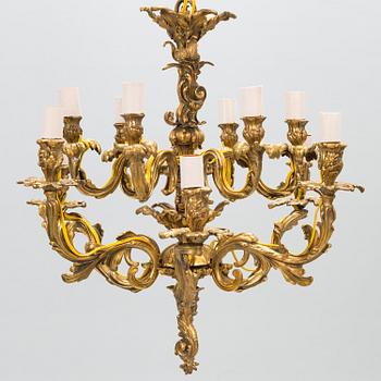 A late 19th-century 12-arm bronze chandelier.