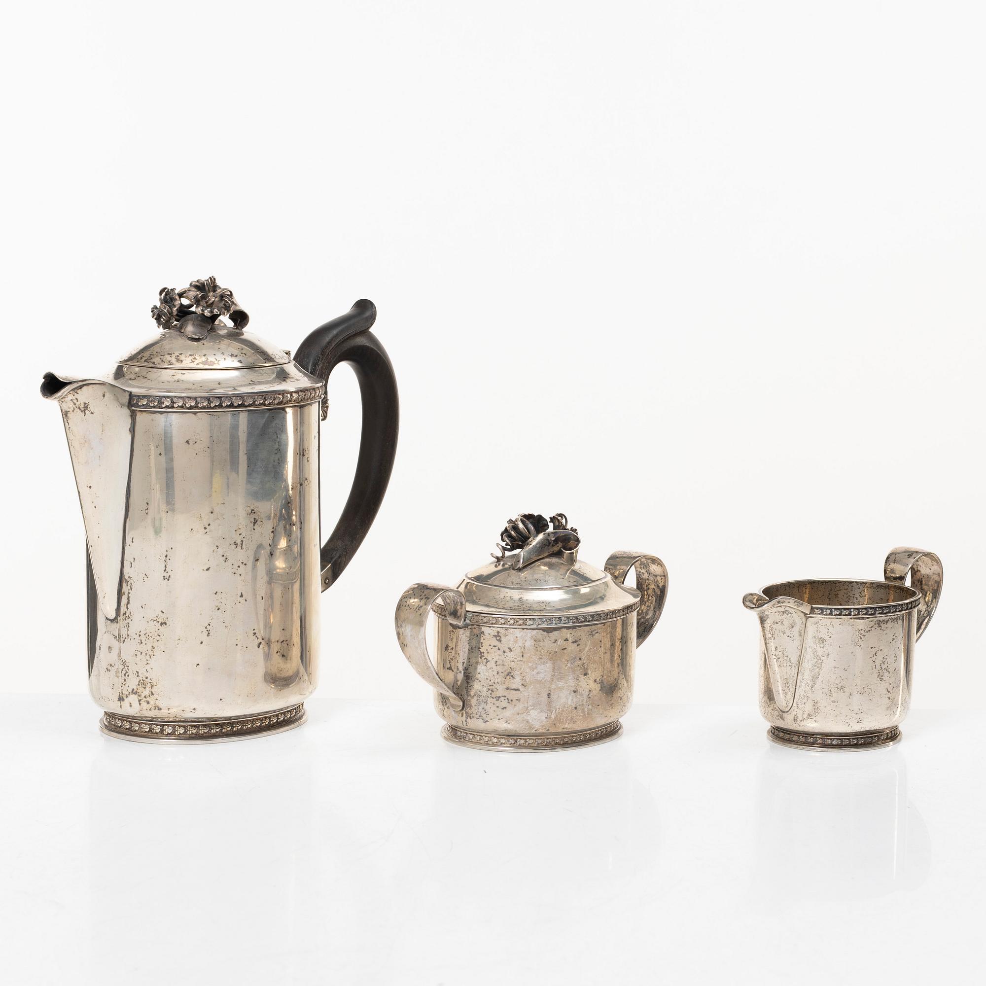 A Swedish silver coffee pot, cream jug and sugar bowl, mark of Caneman & Wallen, Stockholm 1949.