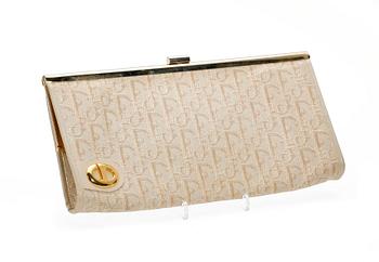 1423. A white monogram canvas clutch by Christian Dior.