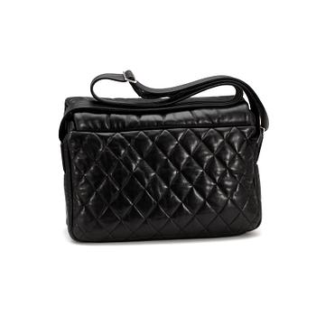 CHANEL, a quilted black mens messenger bag.