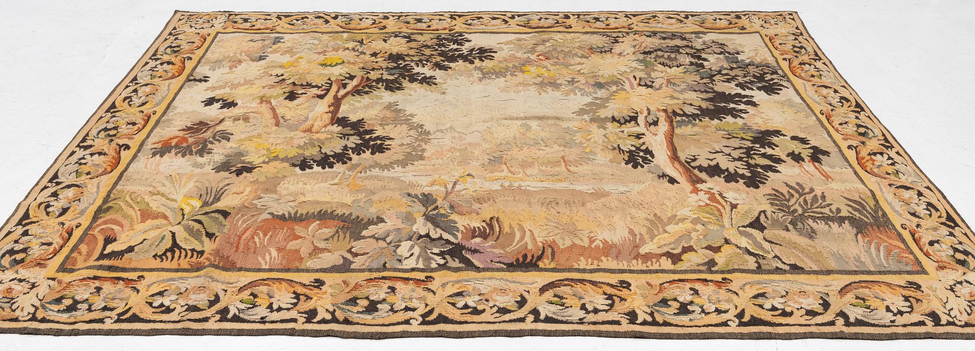 A European 'verdur' tapestry, c. 297 x 290 cm, 17th century.