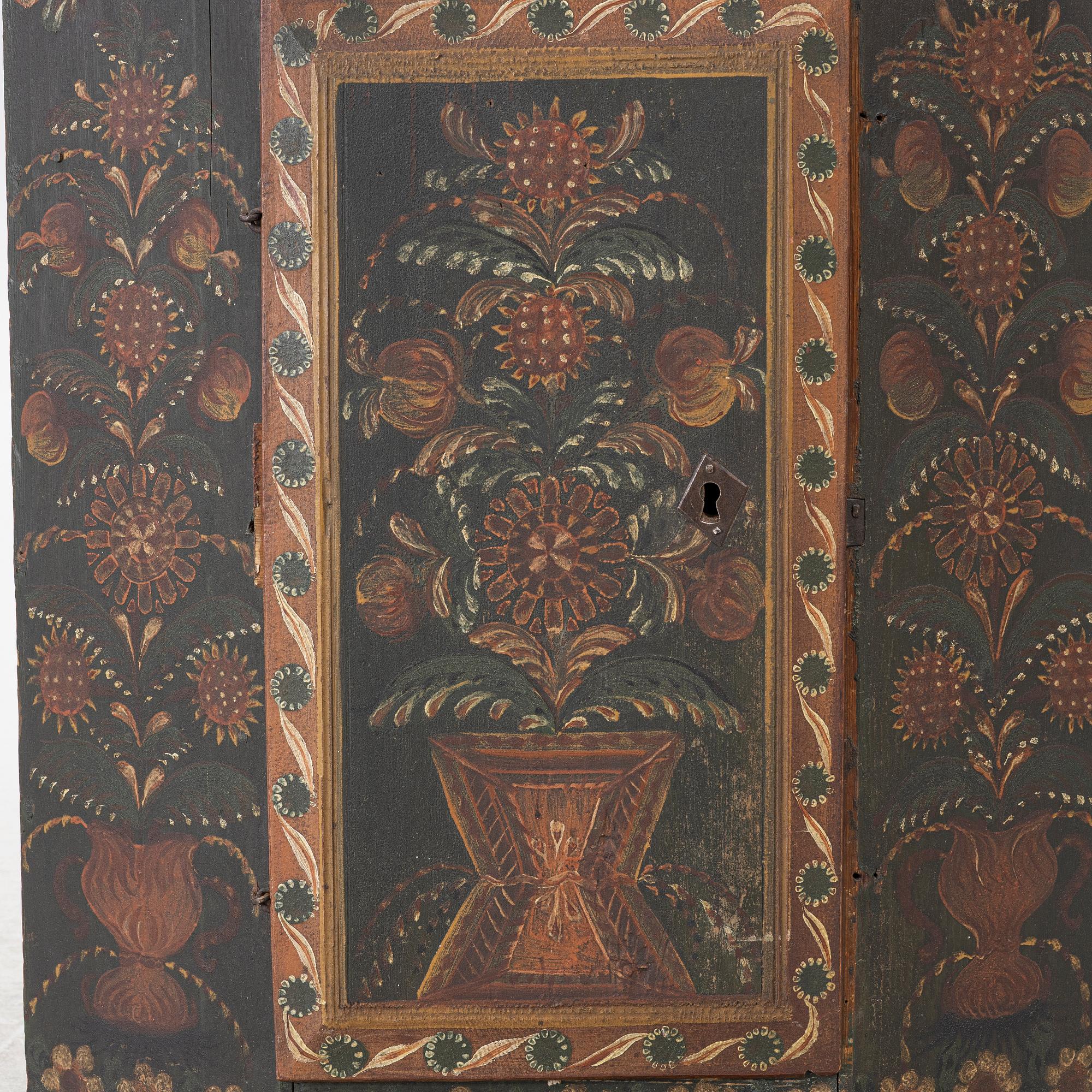 A corner hanging cabinet, dated 1844.