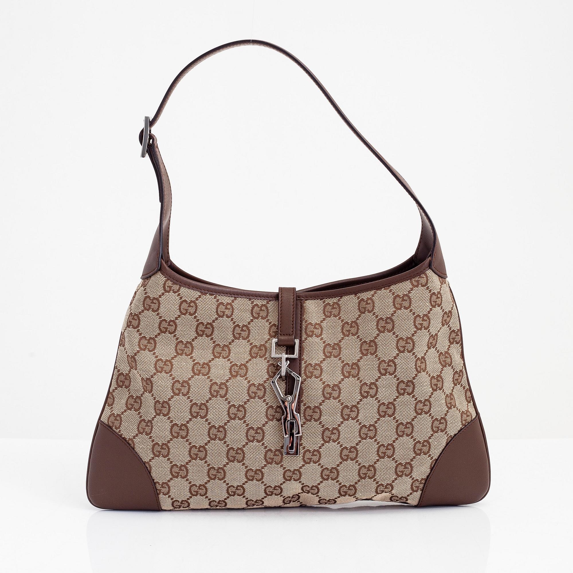 Gucci a Monogram Jackie bag. Bukowskis