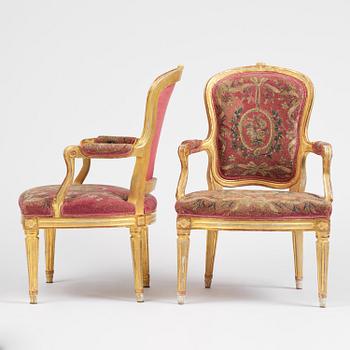 A pair of Gustavian giltwood open armchairs, Stockholm, late 18th century.