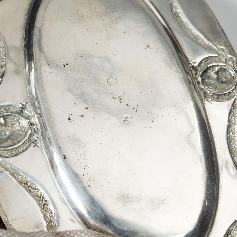 A Rococo style silver sauce boat with dish, 20th Century.