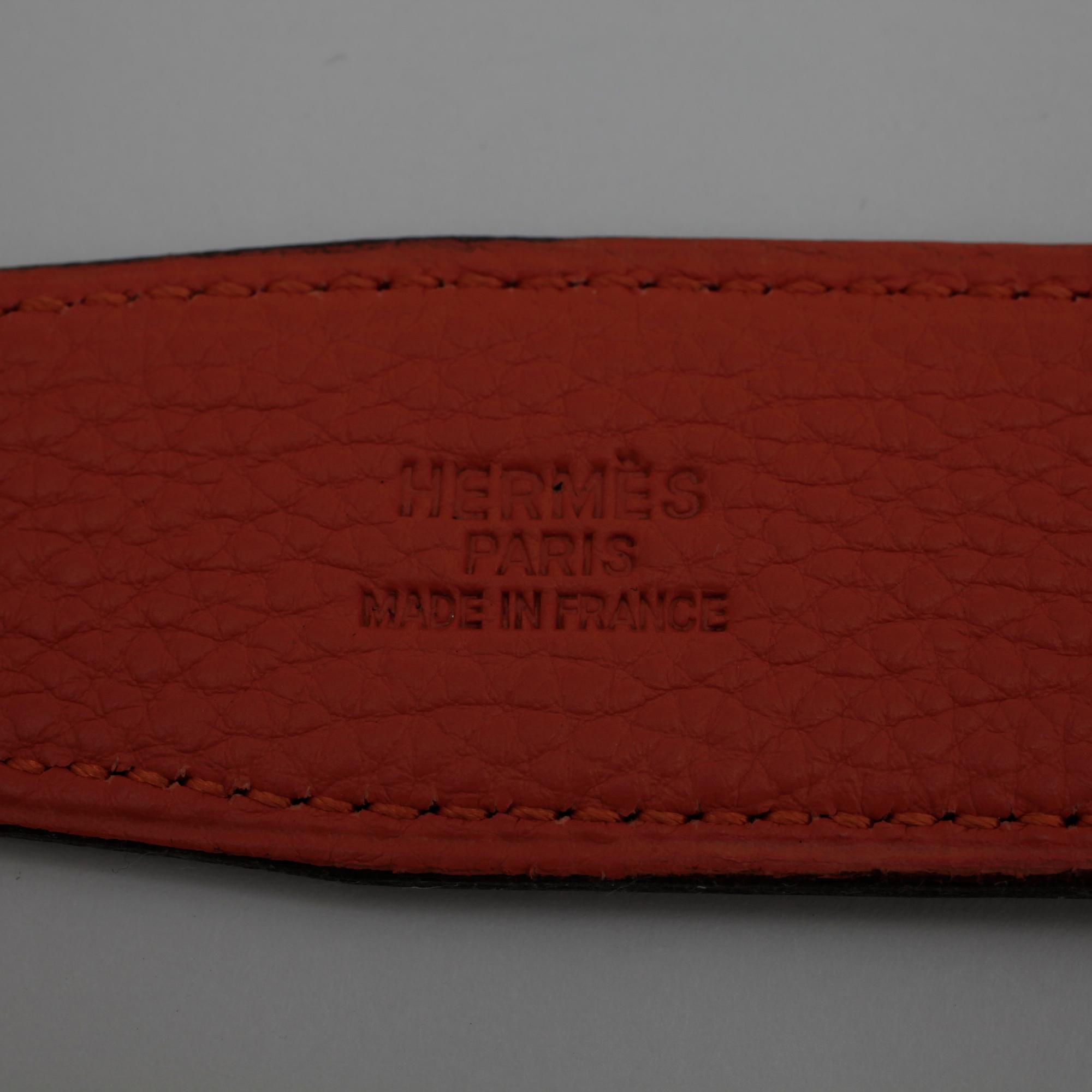 HERMÈS, a black leather belt.