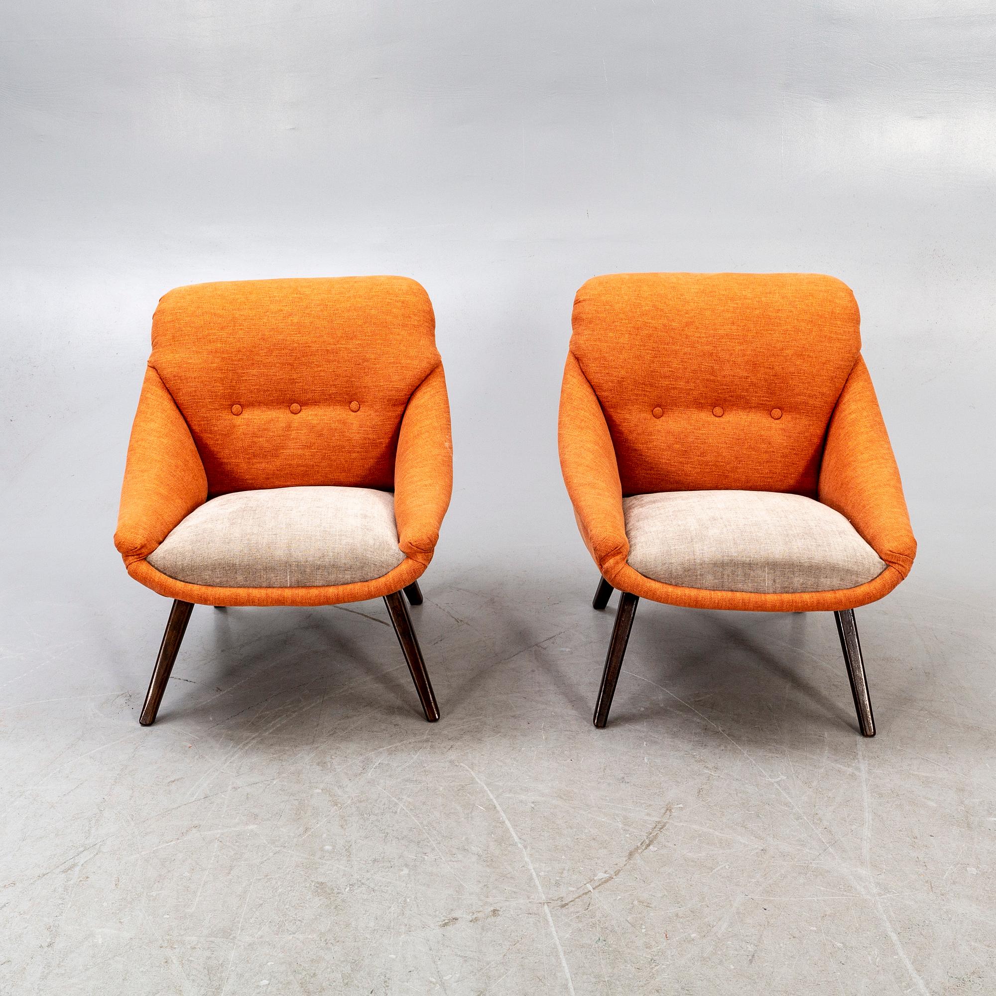A pair of 1950s easy chairs.