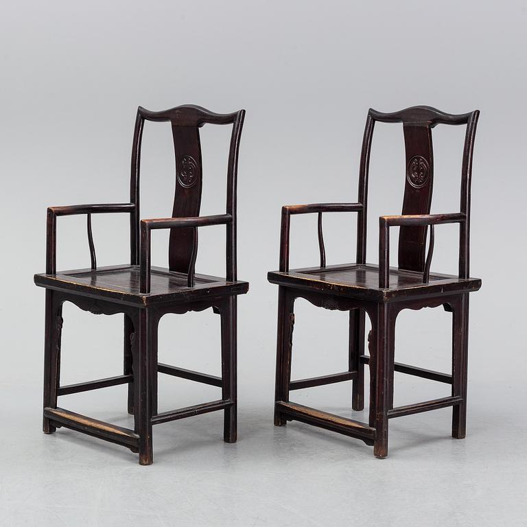 A pair of early 20th century Chinese armchairs.