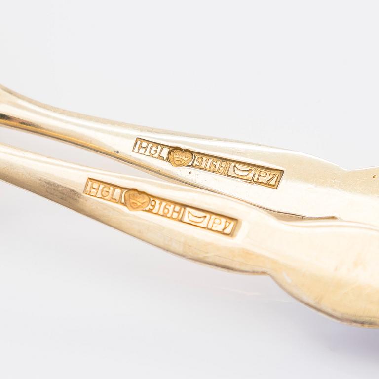 A set of 23 silver gilt and enamel coffee spoons, maker marks of Holger Lindström, Helsinki 1968.