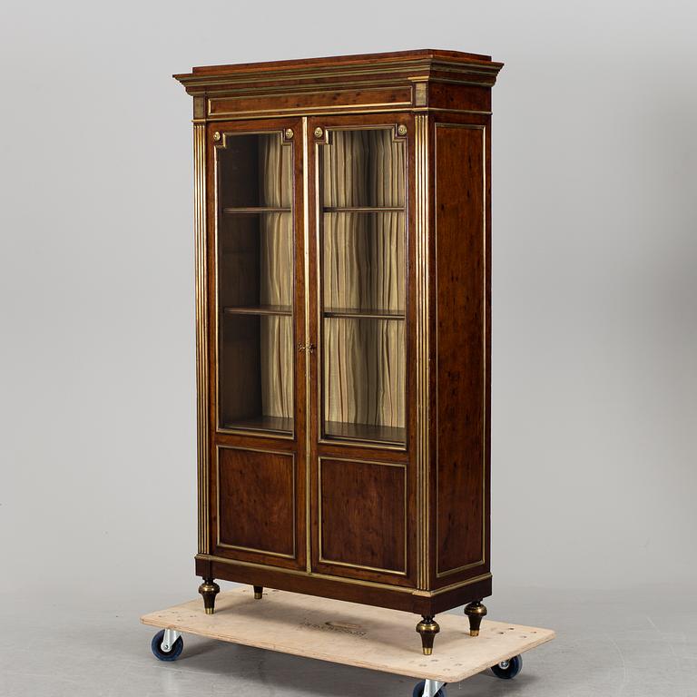 A Russian mahogany veneered display cabinet from around year 1900.