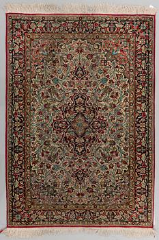 A silk Qum rug, around 114 x 80 cm.