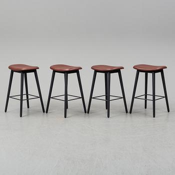 Four contemporary leather upholstred stools by Berlin & Iskos for Muuto.