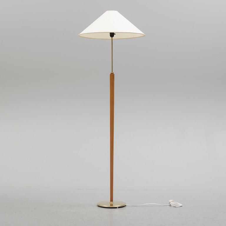 A Bergboms brass and beech standard light, 1940's.