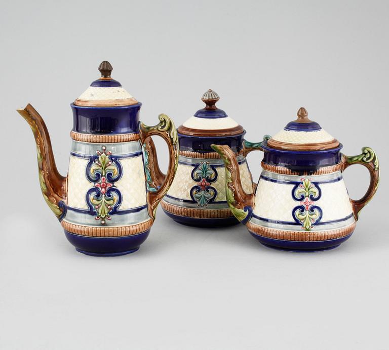 A majolica coffee pot and two tea pots from Gustavsberg, turn of the century 1900.