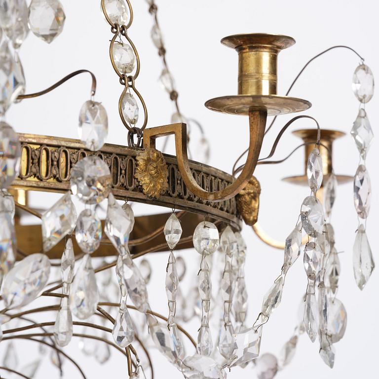 A Late gustavian green top glass six light chandelier.