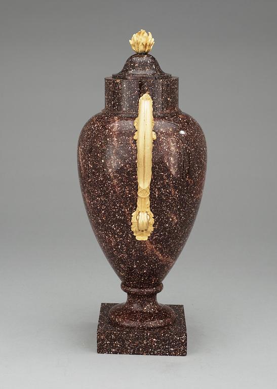 A Swedish Empire 19th Century porphyry and gilt bronze urn.
