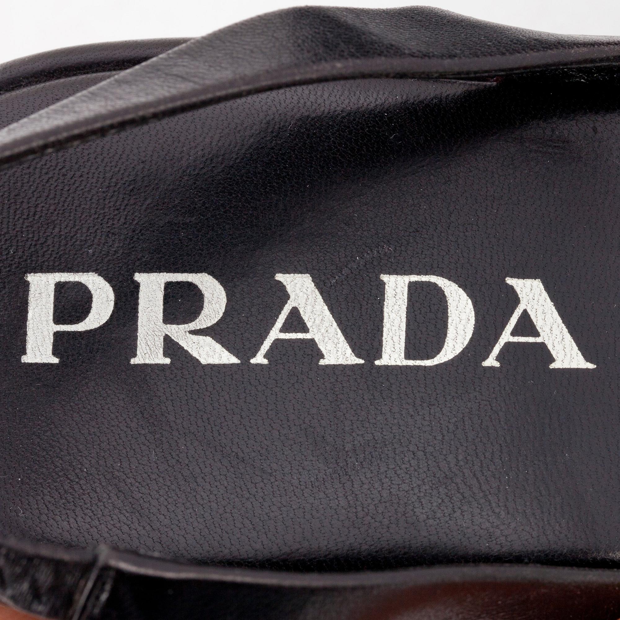 PRADA, a pair of black leather sandals. Size 37.
