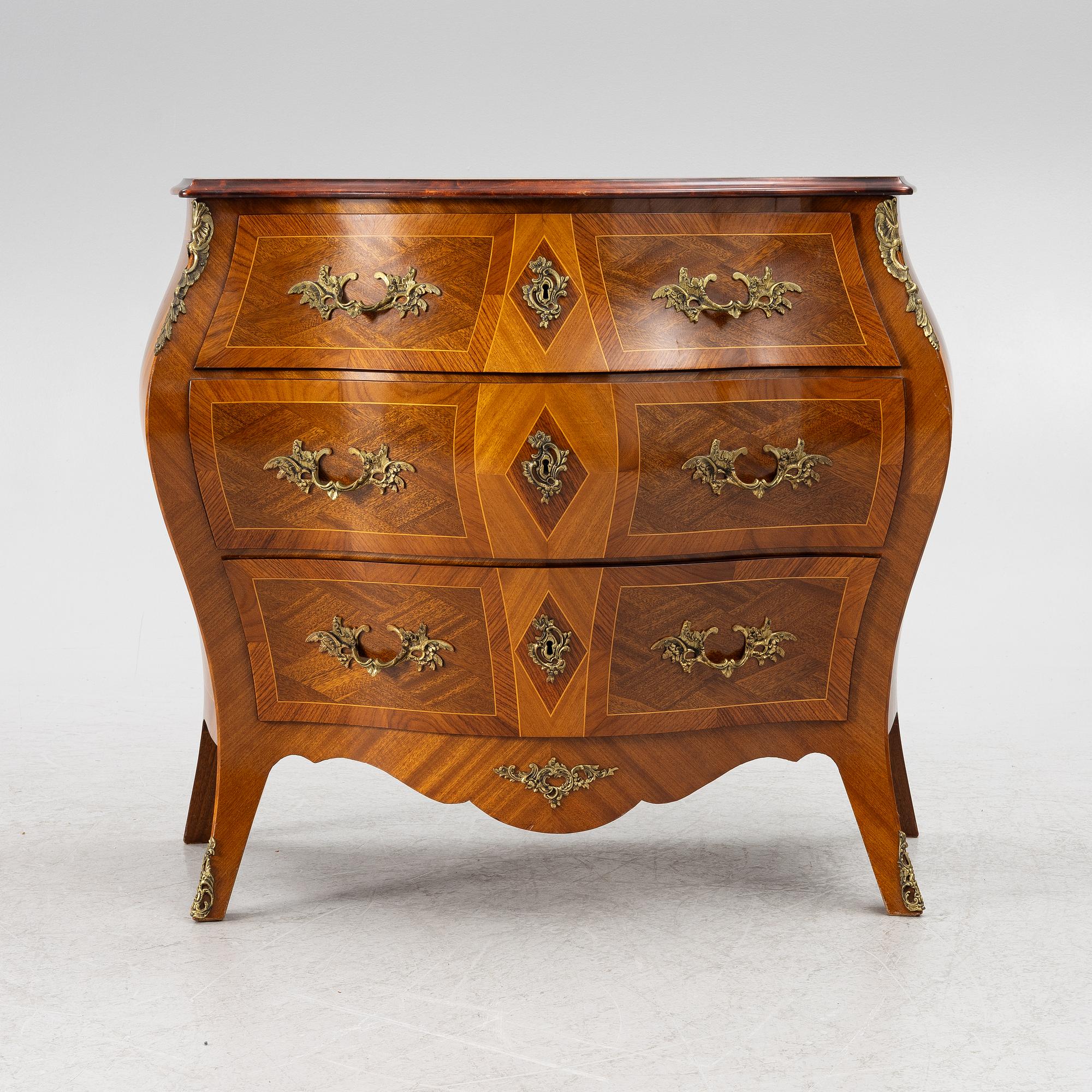 A Rococo style chest of drawers, mid-20th century.