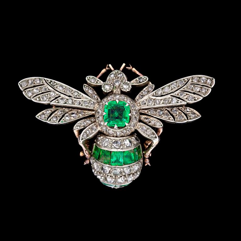 An emerald and diamond brooch, c. 1900.