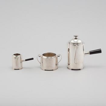 A silver coffee pot, a creamer and a sugar bowl by C F Carlman in Stockholm, 1937 and 1945.