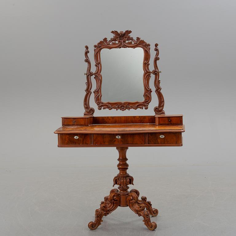 An end of the 19th century Rococo style table with mirror.