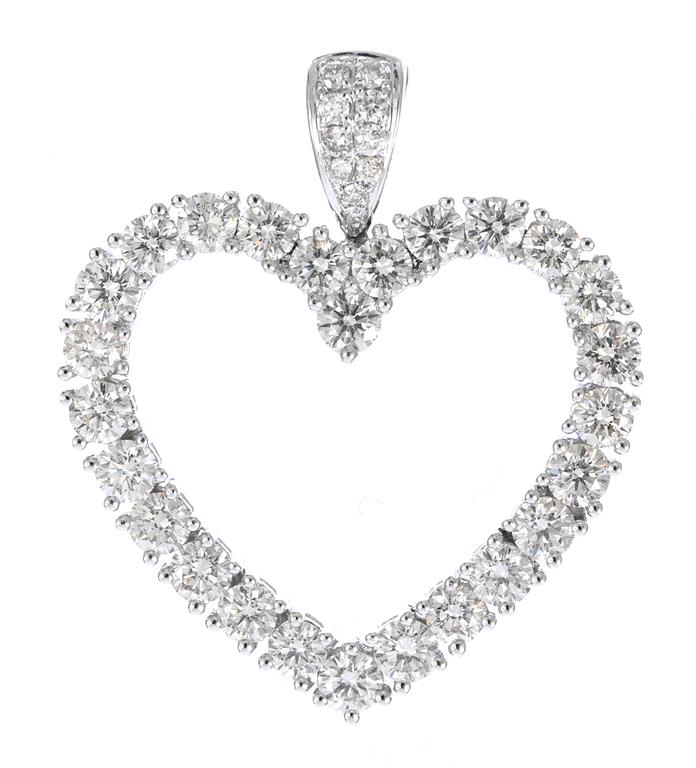 A pendant, heartshaped, set with 36 brilliant cut diamonds, tot. 3 cts.