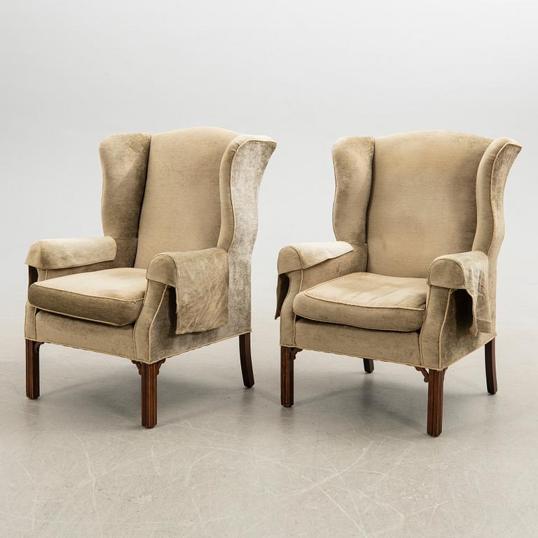 Ear flap armchairs, a pair, England, second half of the 20th century.